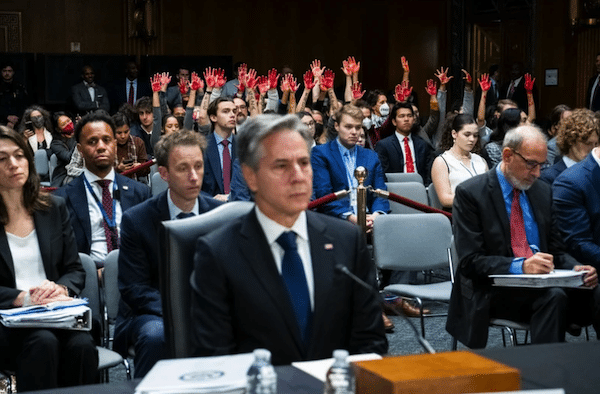 MR Online | Protesters calling for a ceasefire in Gaza raise their hands covered in red paint as Secretary of State Antony Blinken testifies at a Senate appropriations committee hearing to ask for billions more in military aid for Israel on Capitol Hill in Washington DC 31 October Graeme Sloan SIPA USA | MR Online